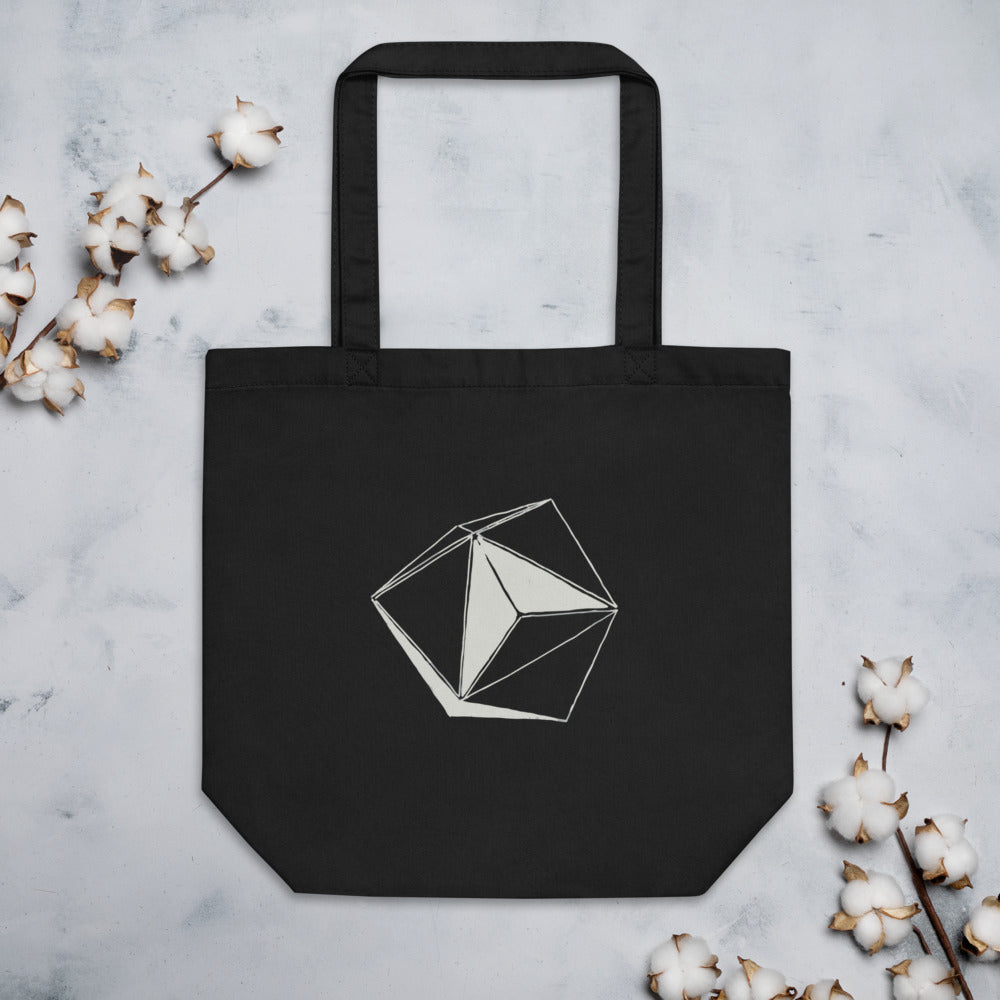 A minimalist line art design of an eight-sided octahedral craft printed on a canvas tote bag. Flat lay, Ink colourway.
