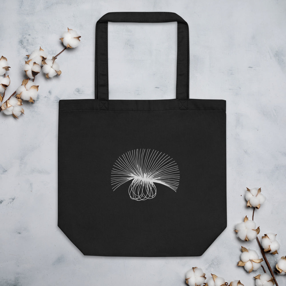 A minimal engraving-style line art study of a sow thistle seed head, printed on a tote bag. Flat lay, Ink colourway.