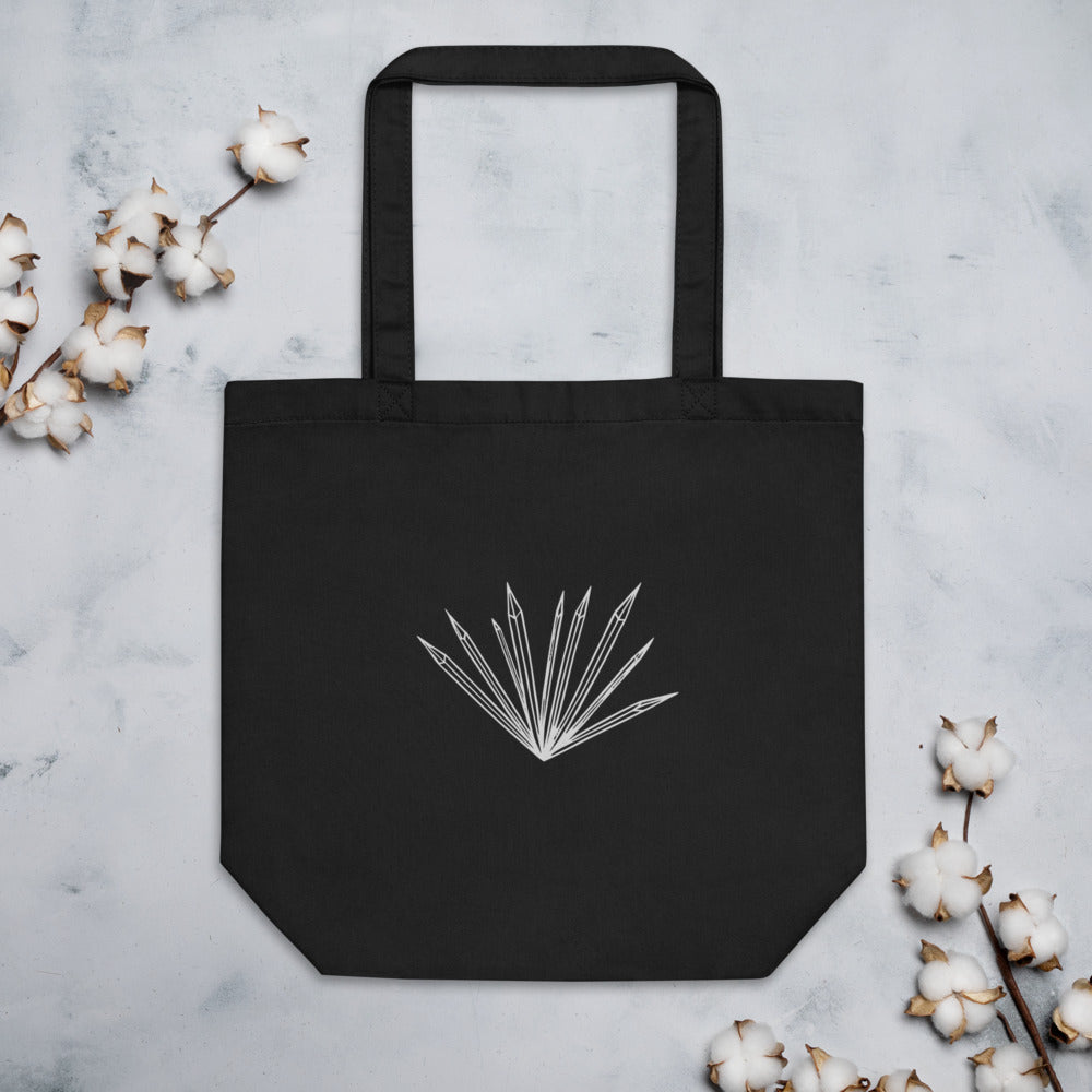 An isolated graphic of radiating hoarfrost crystal needles printed on a tote bag. Flat lay, Ink colourway.