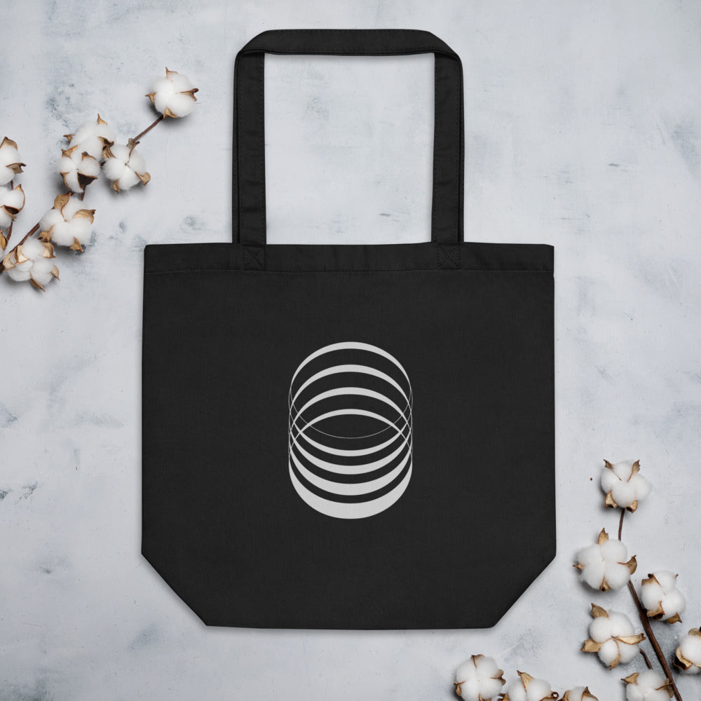 A sequence of eight concentric ellipses progressively flattened and rotated, printed on a tote bag. Flat lay, Ink colourway.