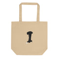 The letter I in a single vertical sumi-e brush gesture, printed on a canvas tote bag. Shown on the Bone (Oyster) colorway.