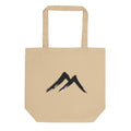 A sharp, two-stroke sumi-e mountain peak design printed on a tote bag. Shown on the Bone (Oyster) colorway.