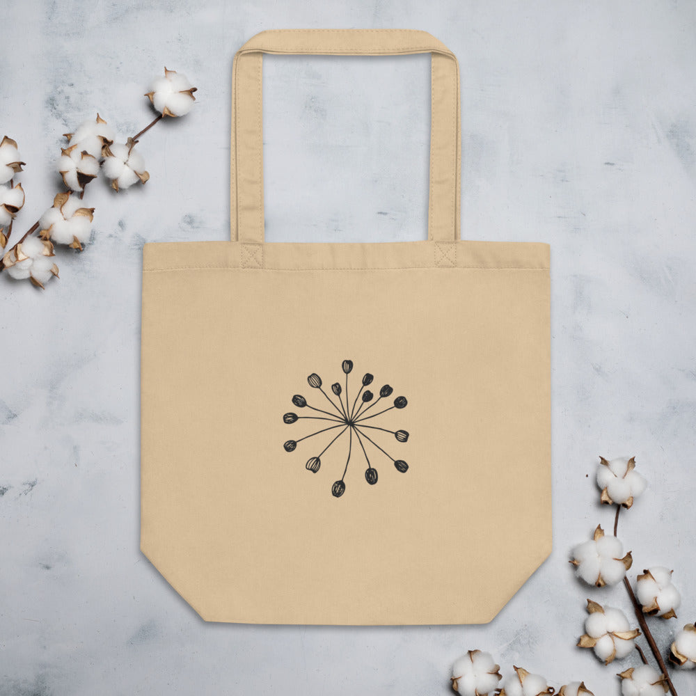 Minimalist engraving-style line art of a fennel seed umbellule printed on a tote bag. Flat lay, Bone colourway.