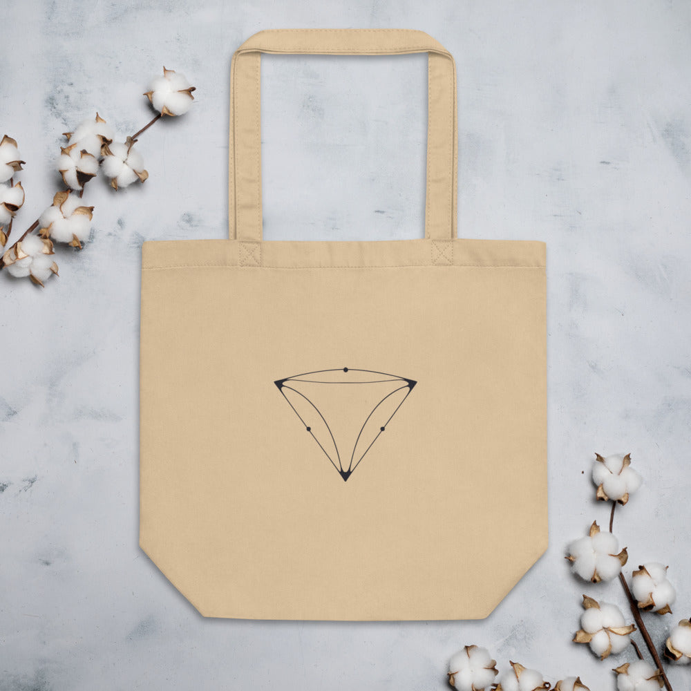 Minimalist line drawing of a triangular UFO craft with three corner lights printed on a tote bag. Flat lay, Bone colourway.
