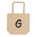 Sumi-e brush stroke of the capital letter G printed on a tote bag. Shown on the Bone (Oyster) colorway.