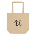 A black sumi-e ink brushstroke of the capital letter U printed on a tote bag. Shown on the Bone (Oyster) colorway.