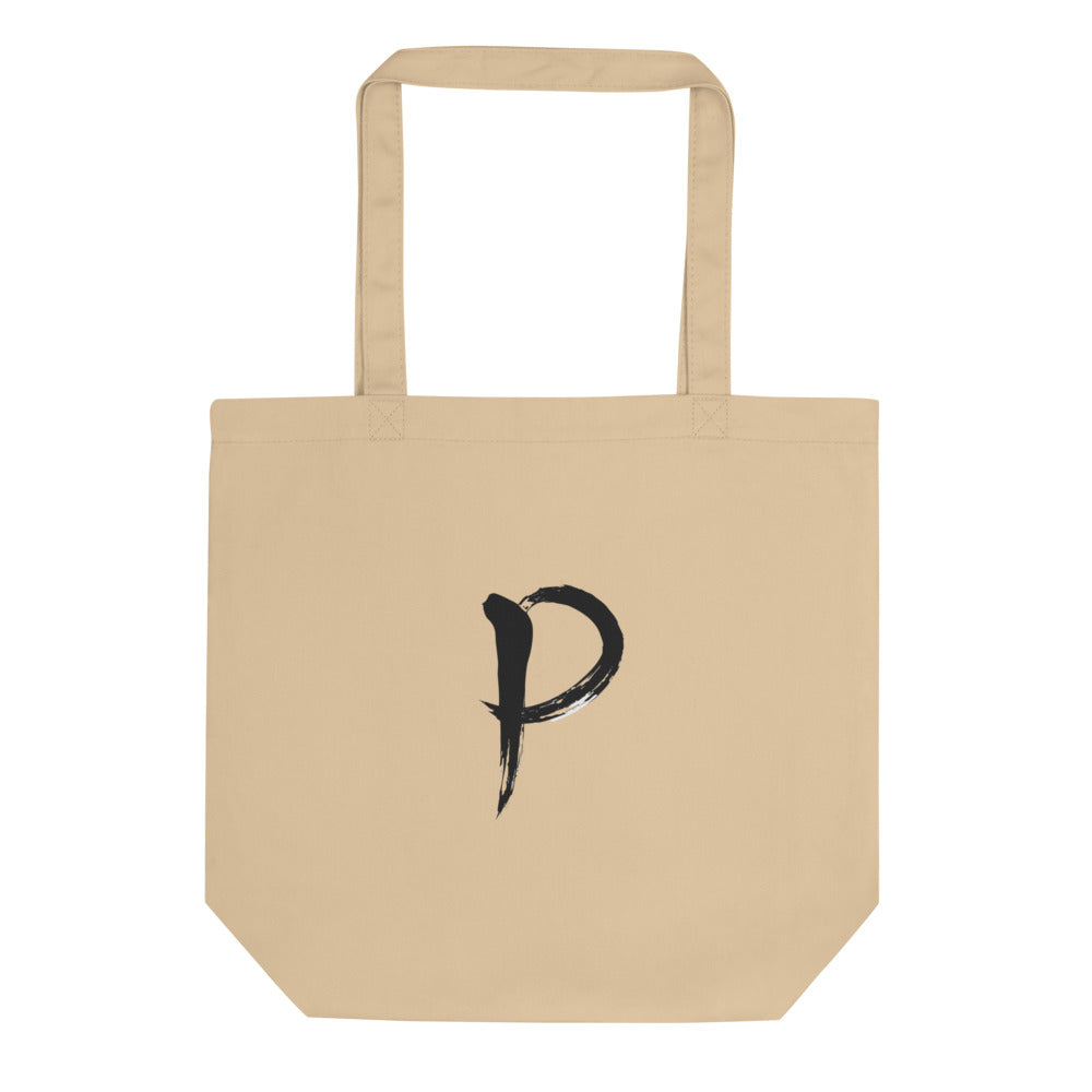 The letter P in black sumi-e brush calligraphy printed on a tote bag. Shown on the Bone (Oyster) colorway.