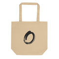 A single black sumi-e brushstroke forming an unclosed letter O on a tote bag. Shown on the Bone (Oyster) colorway.