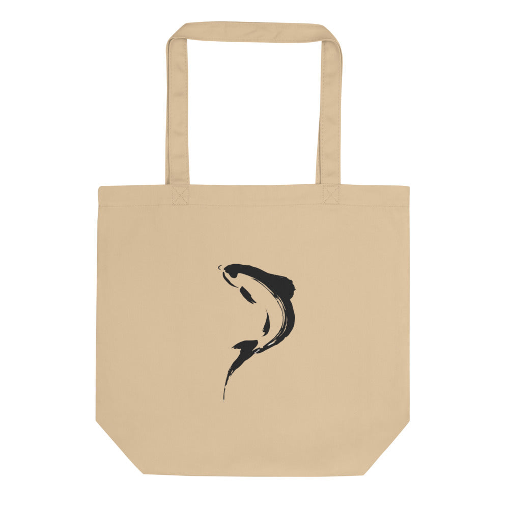 A minimalist sumi-e brushstroke of a rising trout back and tail printed on a tote bag. Shown on the Bone (Oyster) colorway.