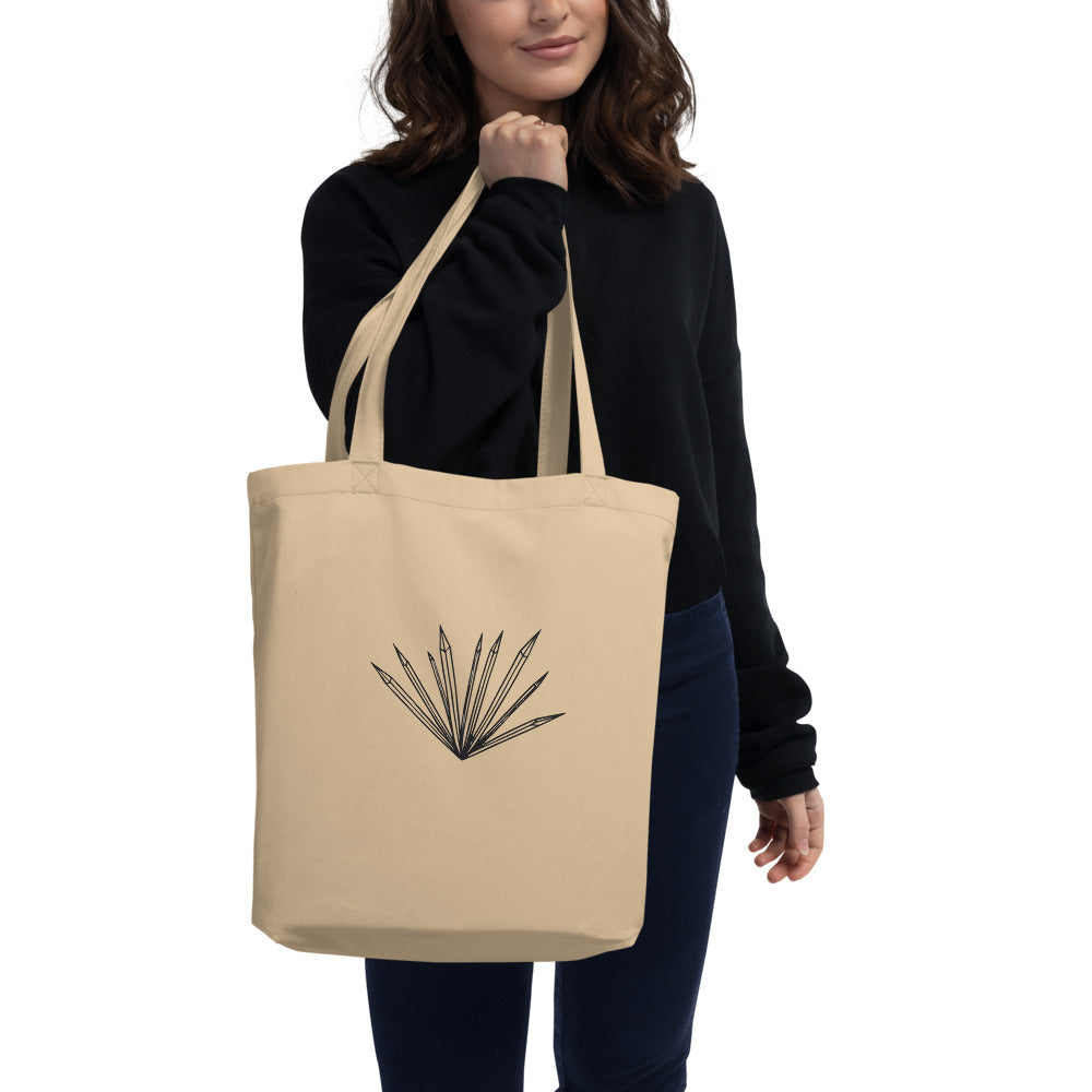 An isolated graphic of radiating hoarfrost crystal needles printed on a tote bag. Carried over the shoulder, Bone colourway.