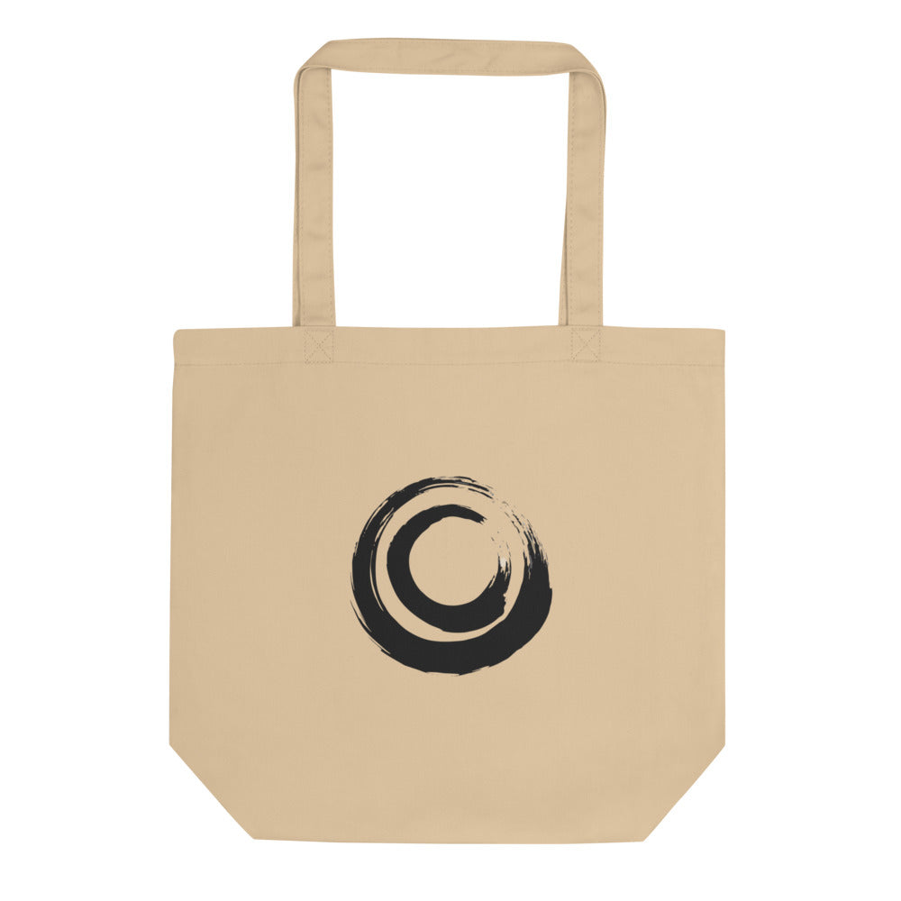 A nested double circle sumi-e brushstroke design printed on a tote bag. Shown on the Bone (Oyster) colorway.