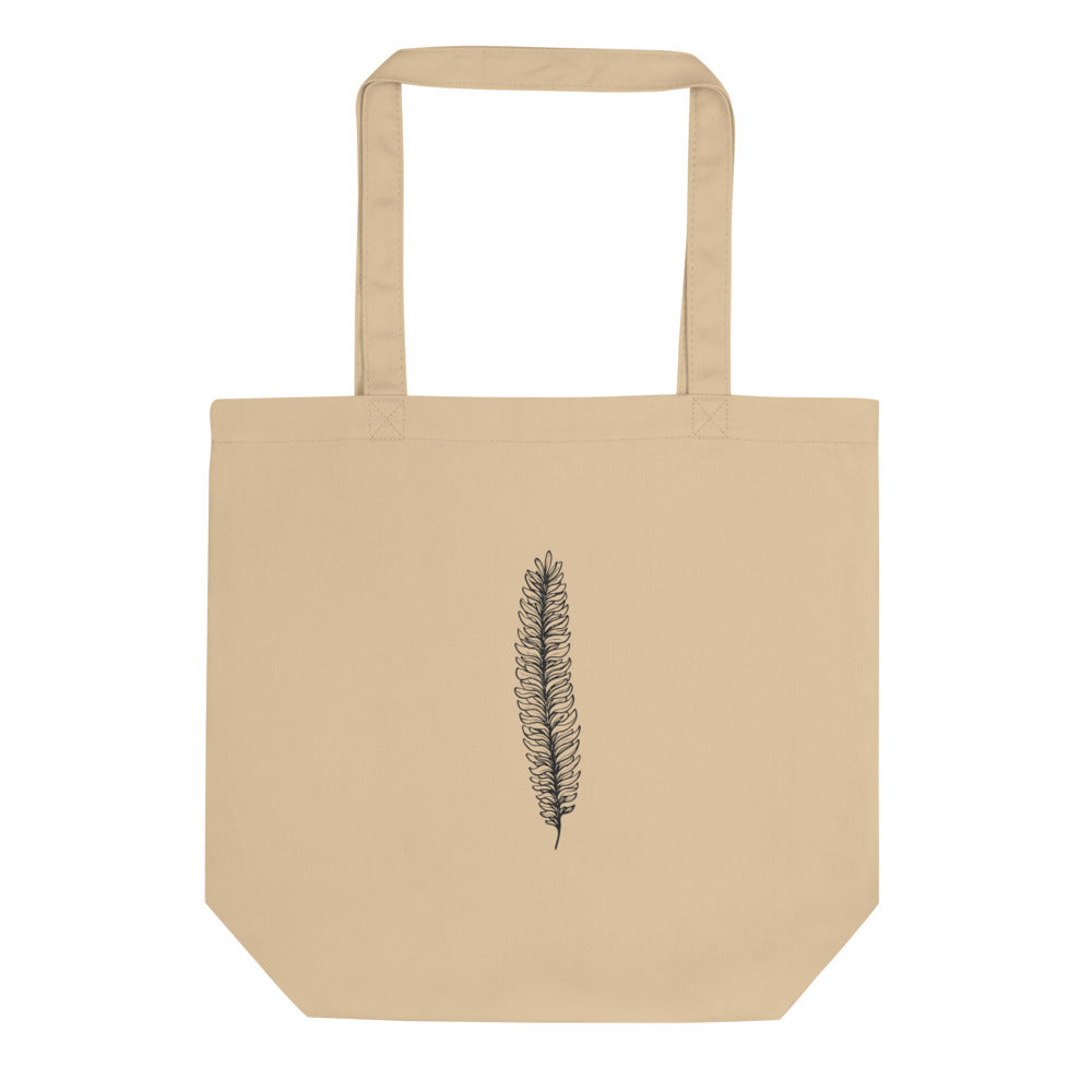 A botanical illustration of a running clubmoss vegetative branchlet printed on a tote bag. Shown on the Bone (Oyster) colorway.