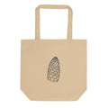 A minimalist line art print of a field horsetail fertile cone on a canvas tote bag. Shown on the Bone (Oyster) colorway.