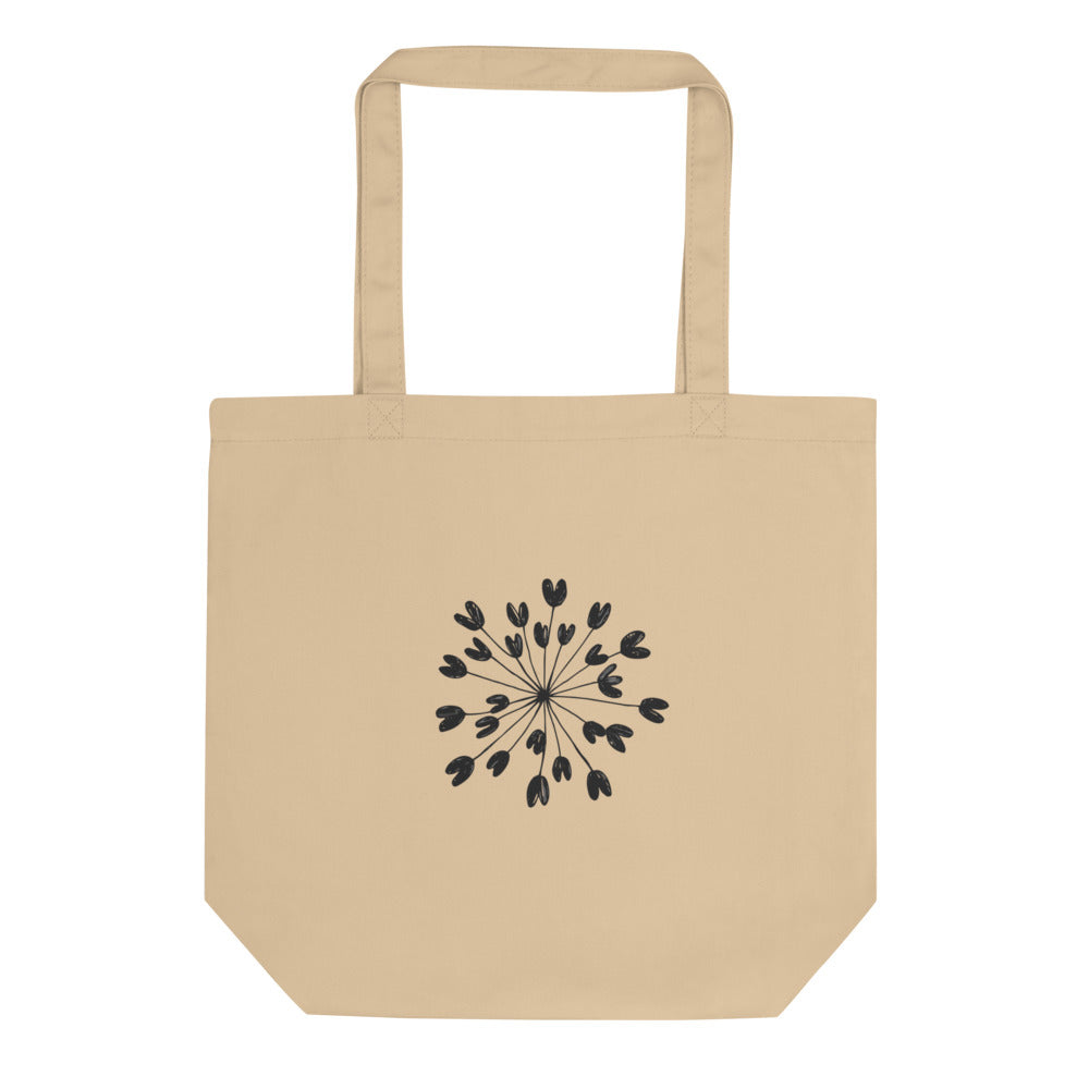 Fine hairline drawing of a lovage seed umbellule with radiating stems and ribbed seeds on a tote bag. Shown on the Bone (Oyster) colorway.