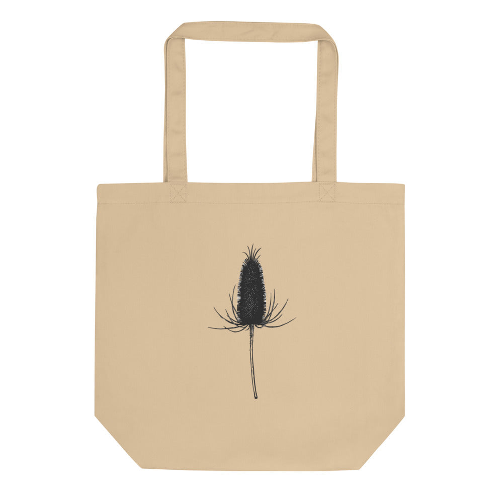 A detailed botanical line drawing of a dried teasel seed head on a tote bag. Shown on the Bone (Oyster) colorway.