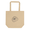 An isometric wireframe grid mapping the irregular form of Mars' moon Phobos, printed on a tote bag. Shown on the Bone (Oyster) colorway.