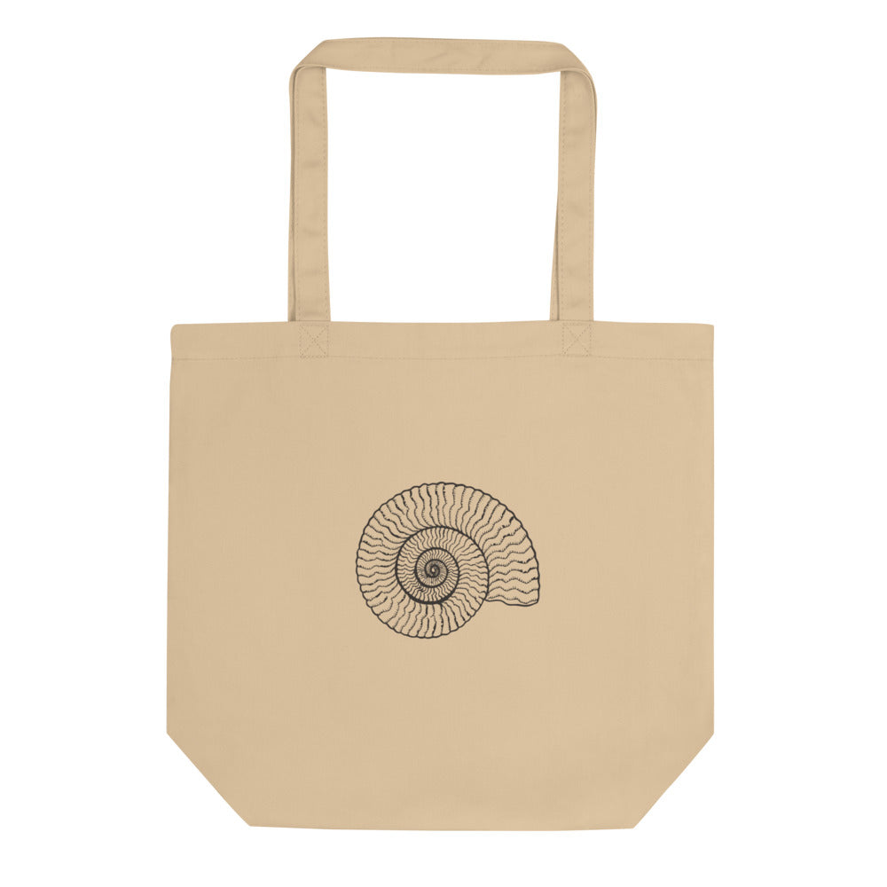A precise line art illustration of a Dactylioceras commune ammonite in dorsal-lateral view, printed on a tote bag. Shown on the Bone (Oyster) colorway.
