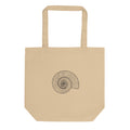 A precise line art illustration of a Dactylioceras commune ammonite in dorsal-lateral view, printed on a tote bag. Shown on the Bone (Oyster) colorway.