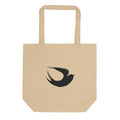 A minimalist sumi-e ink brush painting of a flying swallow on a tote bag. Shown on the Bone (Oyster) colorway.