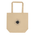 An ink-drawn diagram of a solar sunspot with radiating penumbra filaments printed on a tote bag. Shown on the Bone (Oyster) colorway.