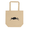 A minimalist sumi-e ink painting of a crab shell and legs printed on a tote bag. Shown on the Bone (Oyster) colorway.
