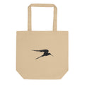 An asymmetric sumi-e ink painting of a gliding heron in flight, printed on a tote bag. Shown on the Bone (Oyster) colorway.