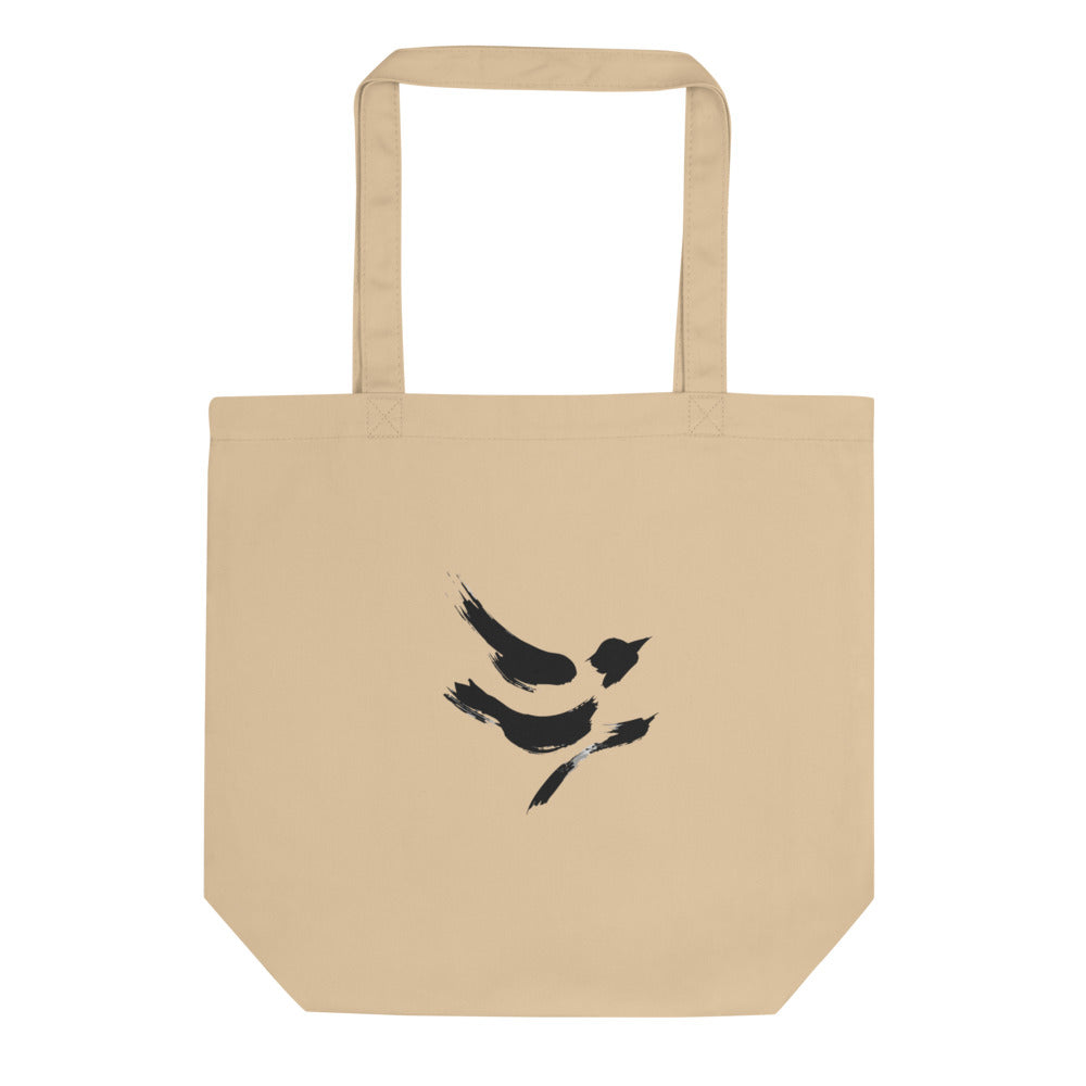The minimal sumi-e design of a diving sparrow printed on a canvas tote bag. Shown on the Bone (Oyster) colorway.