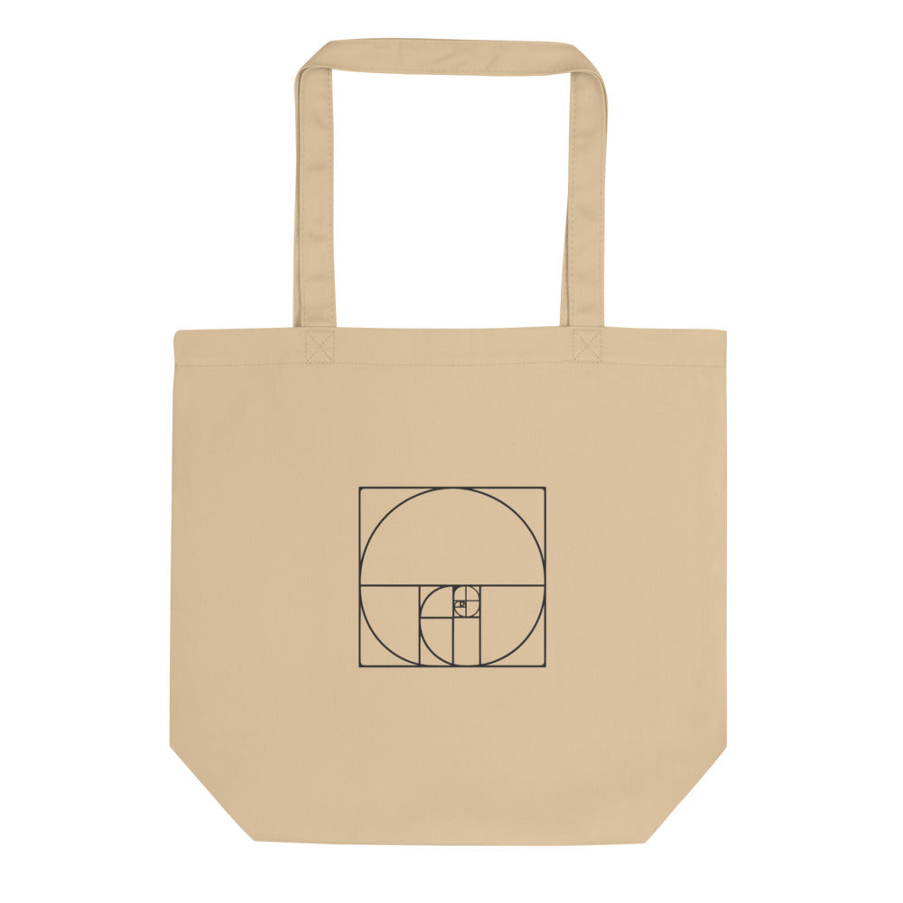 A minimalist geometric design featuring nesting Fibonacci squares and a sweeping logarithmic arc in fine hairline lines on a tote bag. Shown on the Bone (Oyster) colorway.