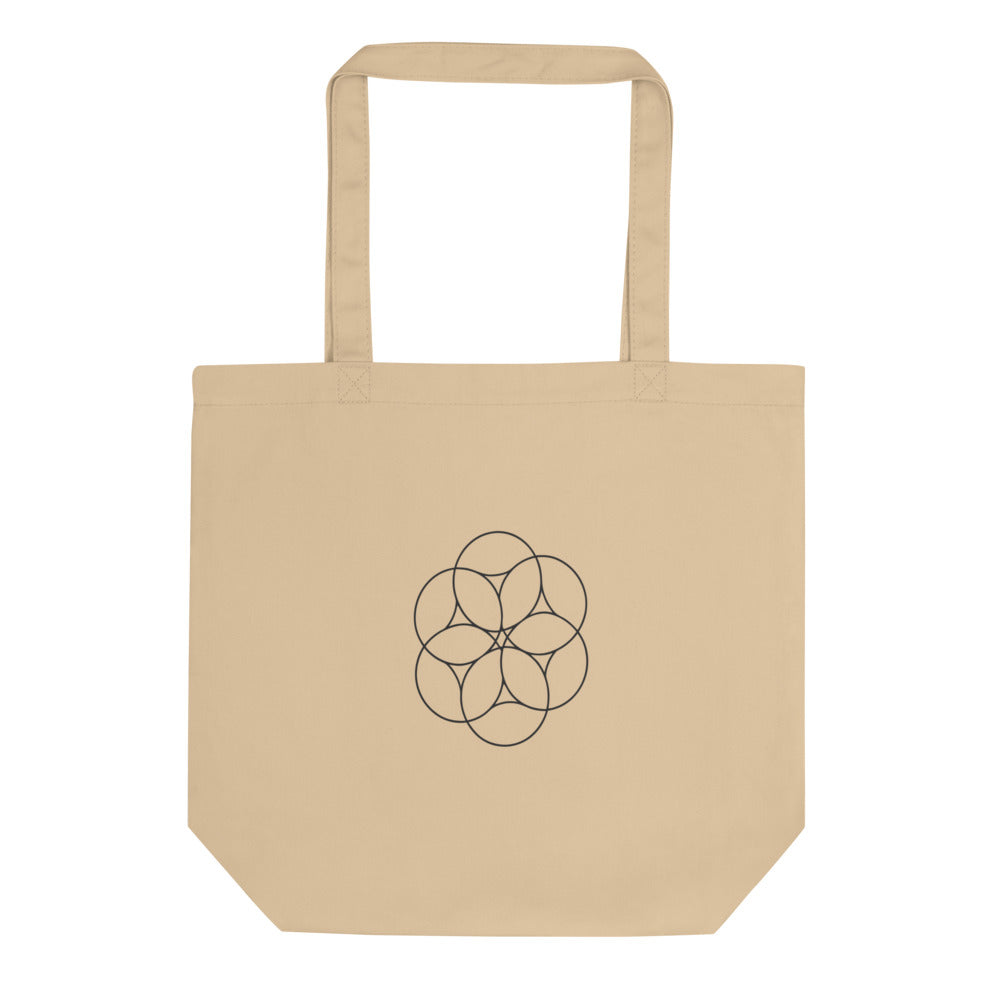 An orthographic projection of hexagonal close packing spheres in wireframe circles on a tote bag. Shown on the Bone (Oyster) colorway.