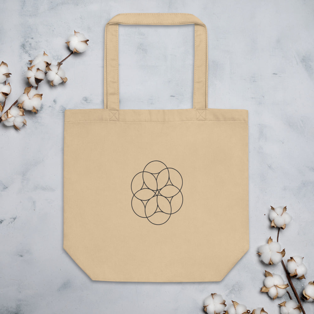 An orthographic projection of hexagonal close packing spheres in wireframe circles on a tote bag. Flat lay, Bone colourway.