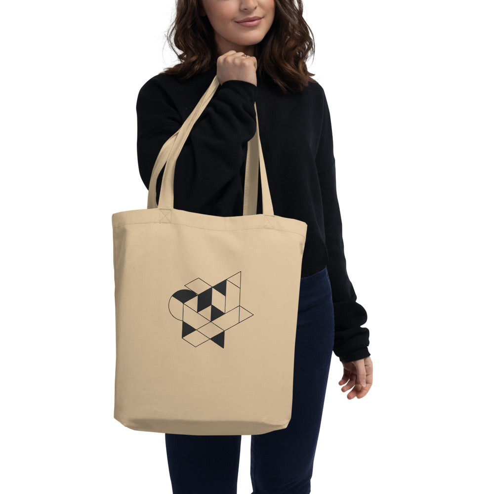 Isometric impossible tribar geometric line art design printed on a tote bag. Carried over the shoulder, Bone colourway.