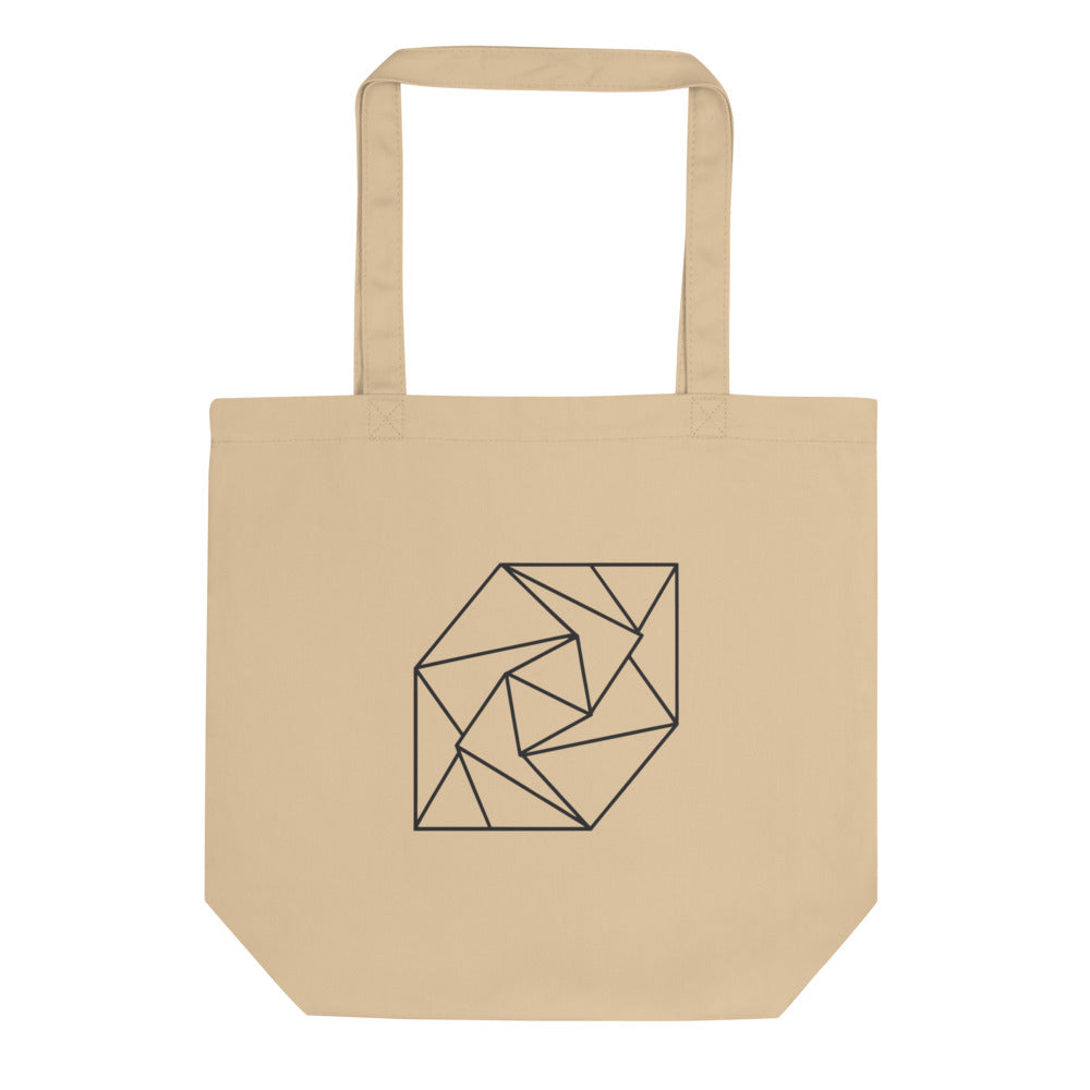A spiral progression of twelve folded triangular planes in a hairline-weight line art print on a classic tote bag. Shown on the Bone (Oyster) colorway.