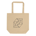 A spiral progression of twelve folded triangular planes in a hairline-weight line art print on a classic tote bag. Shown on the Bone (Oyster) colorway.