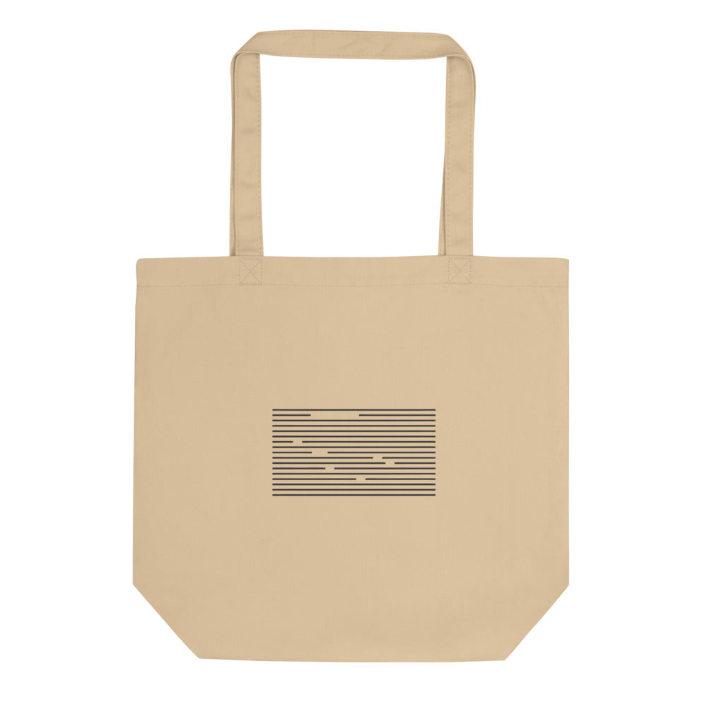 A staggered grid of ruled horizontal line segments printed in a minimalist linear abstract style on a cotton tote bag. Shown on the Bone (Oyster) colorway.