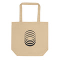 A sequence of eight concentric ellipses progressively flattened and rotated, printed on a tote bag. Shown on the Bone (Oyster) colorway.