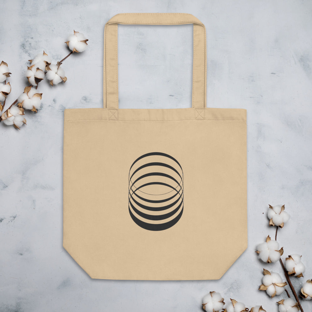 A sequence of eight concentric ellipses progressively flattened and rotated, printed on a tote bag. Flat lay, Bone colourway.