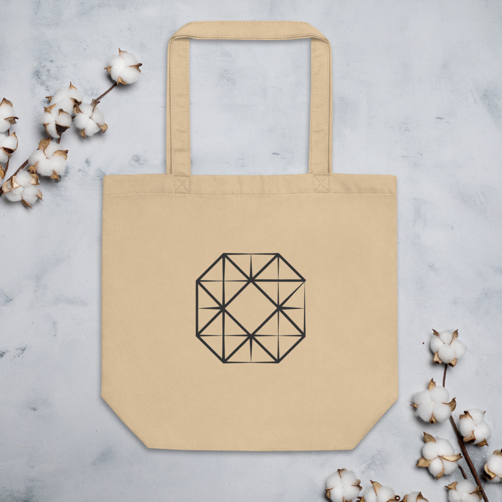 Technical illustration of four interlocking squares rotated ninety degrees on a cotton tote bag. Flat lay, Bone colourway.