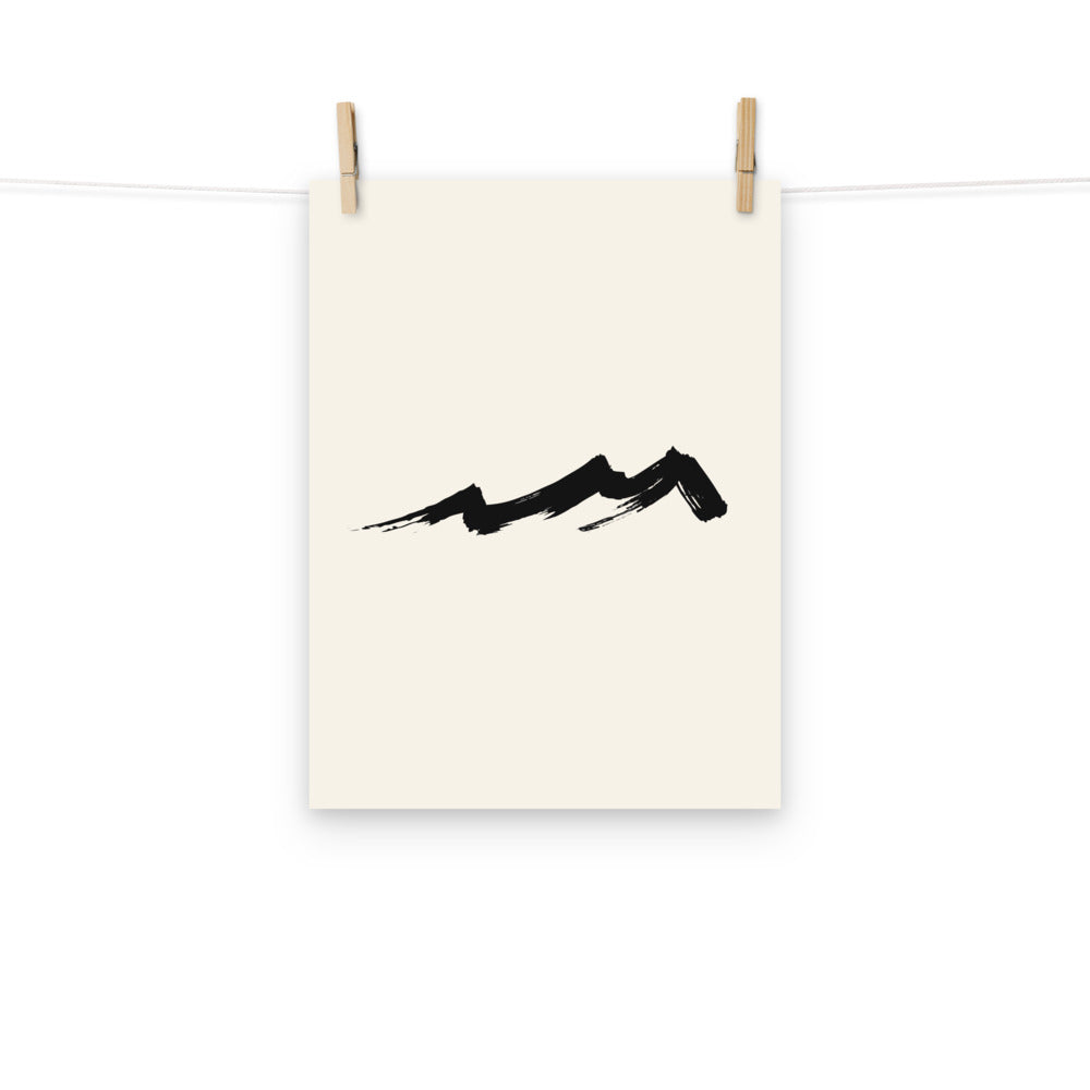 A sharp jagged spur mountain sumi-e design printed on an art print. Hung with wooden pegs, 12″×16″ size.