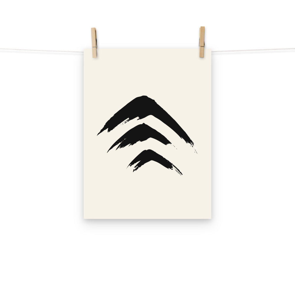Three stacked sumi-e mountain peaks printed on a minimal art print. Hung with wooden pegs, 12″×16″ size.