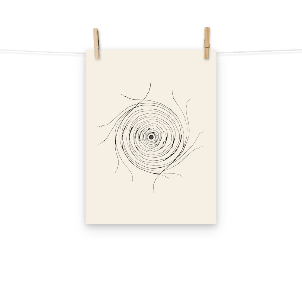 A minimalist celestial line art design mapping the radial filaments of the Helix Nebula printed on an art print. Hung with wooden pegs, 12″×16″ size.