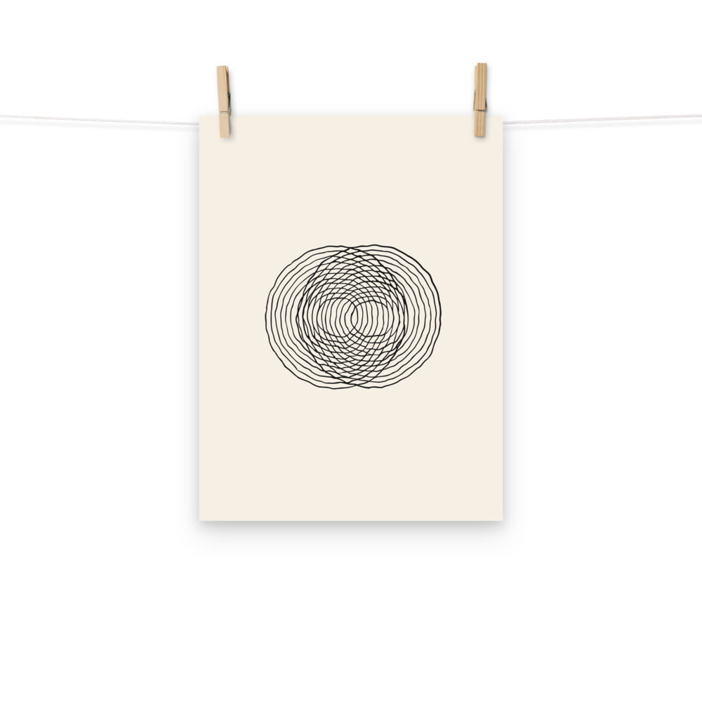 A minimalist diagram of intersecting concentric raindrop ripple rings printed on an art print. Hung with wooden pegs, 12″×16″ size.