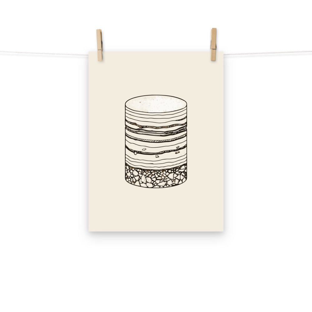 The stippled illustration of a vertical drilled core sample with graded bedding on an art print. Hung with wooden pegs, 12″×16″ size.