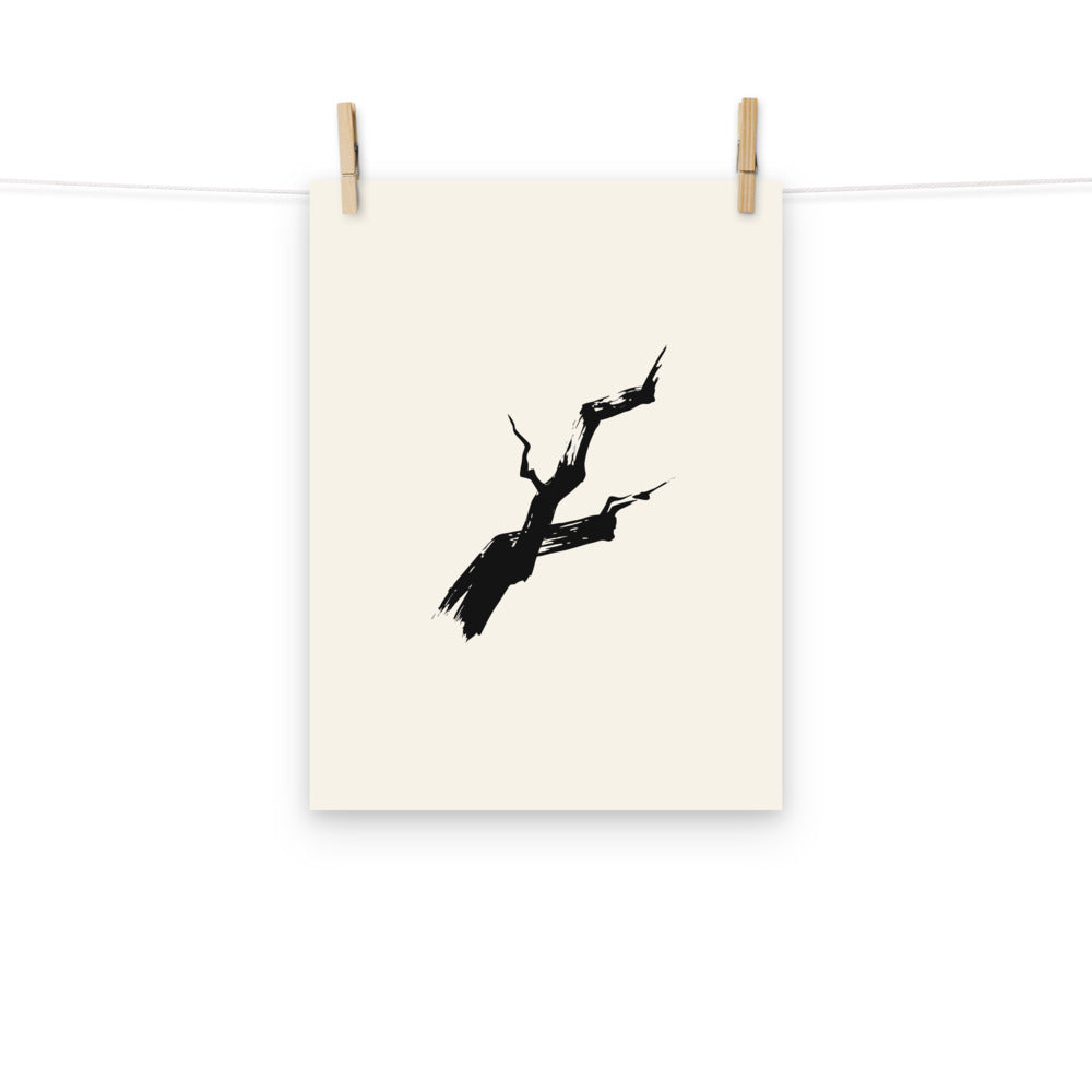 A rugged dry-brush sumi-e painting of a jagged pine branch printed on a fine art print. Hung with wooden pegs, 12″×16″ size.