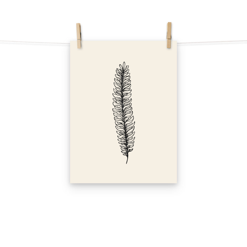 A botanical illustration of a running clubmoss vegetative branchlet printed on an art print. Hung with wooden pegs, 12″×16″ size.