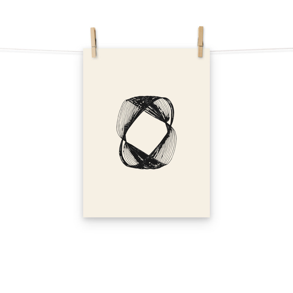 An engraving-style astronomical line art print of Saturn's braided F-ring structure on paper. Hung with wooden pegs, 12″×16″ size.
