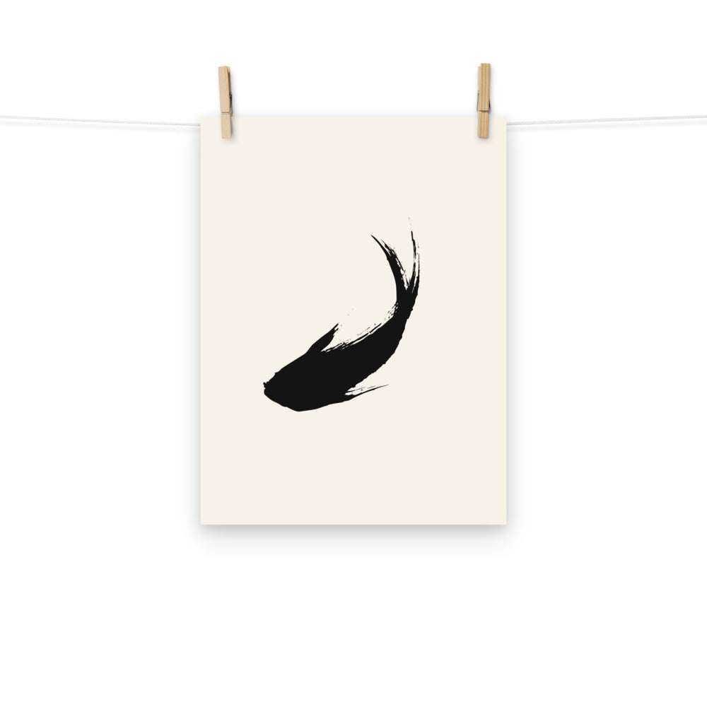 A minimal sumi-e ink brush painting of a single ascending carp printed on a premium art print. Hung with wooden pegs, 12″×16″ size.