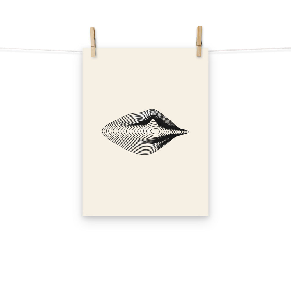 An engraving-style topographic contour design forming an asymmetric eye printed on an art print. Hung with wooden pegs, 12″×16″ size.