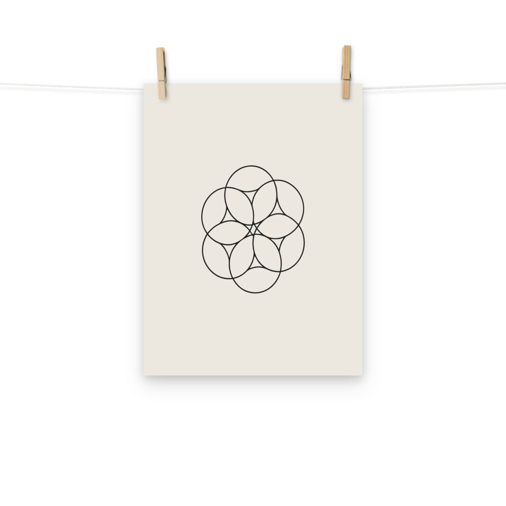 An orthographic projection of hexagonal close packing spheres in wireframe circles on an art print. Hung with wooden pegs, 12″×16″ size.