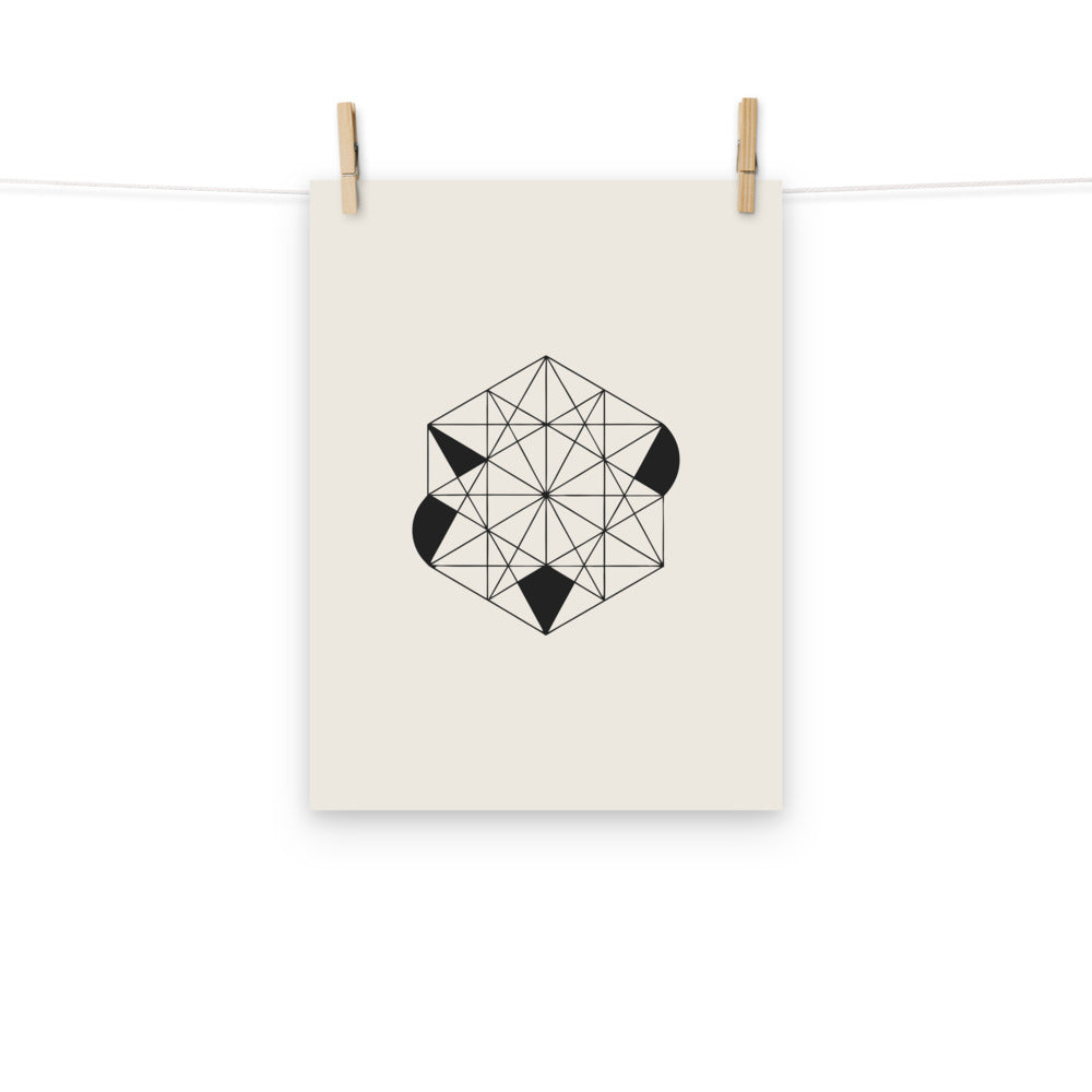 A close-up of a tri-hexagonal Kagome lattice pattern with interlocking stars and hexagons in fine lines on an art print. Hung with wooden pegs, 12″×16″ size.