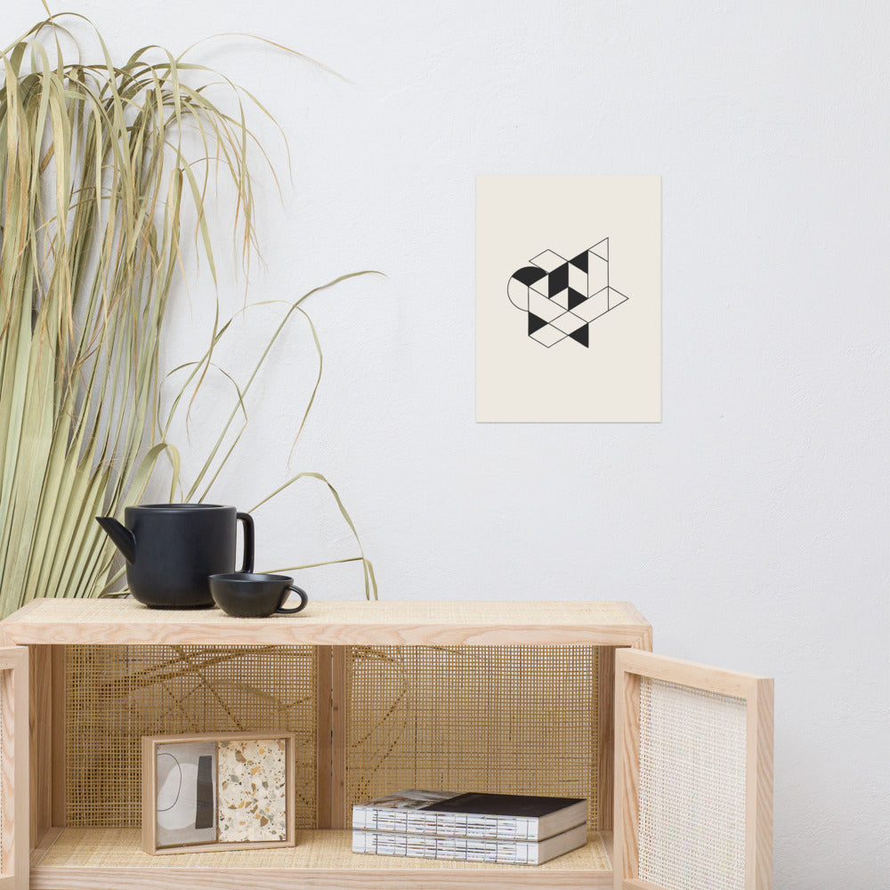 Isometric impossible tribar geometric line art design printed on an art print. Above a rattan cabinet, 12″×16″ size.